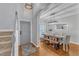 Elegant dining room with hardwood floors, contemporary lighting, and stylish furniture, perfect for entertaining at 4028 Winecott Dr, Apex, NC 27502
