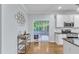Kitchen with access to the deck, stainless steel appliances, and island at 4028 Winecott Dr, Apex, NC 27502