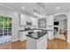 Bright kitchen featuring stainless steel appliances and sliding door access at 4028 Winecott Dr, Apex, NC 27502