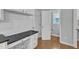 Kitchen desk area with modern finishes, white cabinets, and adjacent bathroom at 4028 Winecott Dr, Apex, NC 27502