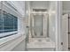 Elegant powder room featuring a framed mirror, a vessel sink, a large window and modern fixtures at 4028 Winecott Dr, Apex, NC 27502