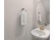 Stylish powder room with a round mirror and designer hardware at 415 Dupree St, Durham, NC 27707