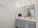 Elegant bathroom featuring dual sinks, quartz countertops, and custom lighting at 415 Dupree St, Durham, NC 27707