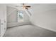 Cozy bedroom featuring neutral walls, carpet, and a bright window at 415 Dupree St, Durham, NC 27707