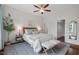 Serene bedroom with a ceiling fan, hardwood floors, and natural light at 415 Dupree St, Durham, NC 27707