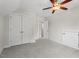 Bedroom with carpet and double doors, perfect for storage at 415 Dupree St, Durham, NC 27707