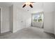 Carpeted bedroom with double closet doors and a bright window at 415 Dupree St, Durham, NC 27707
