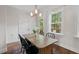 Cozy dining area with backyard access, natural light, and rustic rug at 415 Dupree St, Durham, NC 27707