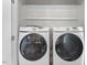 Modern laundry room with front load washer and dryer at 415 Dupree St, Durham, NC 27707