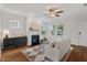 Bright living room featuring a fireplace, hardwood floors, neutral colored furniture and modern decor at 415 Dupree St, Durham, NC 27707