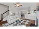 Bright living room with modern furnishings, including a stylish rug and ceiling fan at 415 Dupree St, Durham, NC 27707
