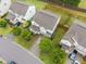 An aerial view shows the house's roof, backyard, driveway, and surrounding mature trees and landscaping at 4212 Auburn Hills Dr, Raleigh, NC 27616
