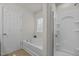 Bright bathroom featuring a soaking tub, shower with glass door, and a window with natural light at 4212 Auburn Hills Dr, Raleigh, NC 27616