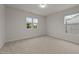 Bright bedroom with two windows and neutral carpeting at 4212 Auburn Hills Dr, Raleigh, NC 27616