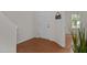 Inviting entryway featuring hardwood floors, white walls, and a view into the next room at 4212 Auburn Hills Dr, Raleigh, NC 27616