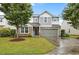 Beautiful two-story home with stone accents, siding, a two-car garage and manicured lawn at 4212 Auburn Hills Dr, Raleigh, NC 27616