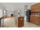 Kitchen featuring granite countertops, stainless refrigerator, and center island at 4212 Auburn Hills Dr, Raleigh, NC 27616