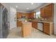 Well-equipped kitchen with a center island, stainless steel appliances, and granite countertops at 4212 Auburn Hills Dr, Raleigh, NC 27616