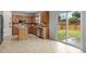 Kitchen featuring granite countertops, tile flooring, and a sliding door to the backyard at 4212 Auburn Hills Dr, Raleigh, NC 27616