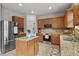 Kitchen featuring granite countertops, stainless appliances, and tile flooring at 4212 Auburn Hills Dr, Raleigh, NC 27616