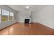 Bright living room featuring a fireplace and hardwood floors at 4212 Auburn Hills Dr, Raleigh, NC 27616