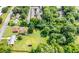 Aerial view showcasing property boundaries, lush landscaping, and a peaceful, tree-filled neighborhood at 424 Camp Rd, Burlington, NC 27217