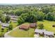 An aerial view of a home featuring lush greenery, a well-maintained lawn, and a serene neighborhood at 424 Camp Rd, Burlington, NC 27217