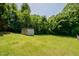 Spacious backyard featuring a shed, perfect for outdoor hobbies and relaxing at 424 Camp Rd, Burlington, NC 27217