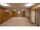 Large basement area with multiple rooms or areas, carpet flooring, and neutral color palette at 424 Camp Rd, Burlington, NC 27217