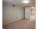 Spacious basement area with closet and carpet flooring offering potential for customization at 424 Camp Rd, Burlington, NC 27217