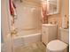 Cozy bathroom with a shower and tub combo, vanity with storage, and a neutral color palette at 424 Camp Rd, Burlington, NC 27217