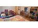 Bedroom with a colorful daybed and dresser featuring patriotic decorations and ample storage at 424 Camp Rd, Burlington, NC 27217