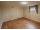 Bedroom with wood-look floors, a closet, and a bright window at 424 Camp Rd, Burlington, NC 27217