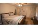 Spacious bedroom with a large bed, closet and carpet flooring, and plenty of natural light at 424 Camp Rd, Burlington, NC 27217