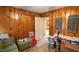 Bedroom features wood paneling and closet with plenty of storage at 424 Camp Rd, Burlington, NC 27217