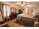 Comfortable bedroom with a large dresser, mirror, and plenty of natural light from the windows at 424 Camp Rd, Burlington, NC 27217