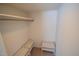 Walk-in closet with hanging rod, beige carpeting, and built-in shelves at 424 Camp Rd, Burlington, NC 27217