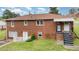 Two story brick home with covered entryway and steps at 424 Camp Rd, Burlington, NC 27217