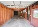 Spacious garage with exposed framing, concrete floor, and potential for workshop or storage at 424 Camp Rd, Burlington, NC 27217