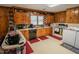 Well-equipped kitchen with wood cabinets, modern appliances, and practical layout at 424 Camp Rd, Burlington, NC 27217