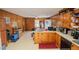 View of kitchen with wood cabinets and an expansive countertop at 424 Camp Rd, Burlington, NC 27217