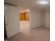Living room with doorframe to another room and neutral carpeting at 424 Camp Rd, Burlington, NC 27217