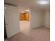 Living room with beige carpet, white walls, and a doorframe at 424 Camp Rd, Burlington, NC 27217