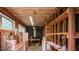 Workshop with insulation and exposed framework, workspace, and small windows for natural light at 424 Camp Rd, Burlington, NC 27217