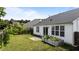Backyard showcasing a well-maintained lawn, privacy fence, and garden, ideal for relaxation at 4408 Jordan Oaks Way, Raleigh, NC 27604