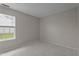 Inviting bedroom with a bright window, plush carpeting and neutral wall color at 4408 Jordan Oaks Way, Raleigh, NC 27604