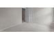 Cozy bedroom with an open doorway, plush carpeting and neutral wall color at 4408 Jordan Oaks Way, Raleigh, NC 27604