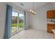 Bright and open dining area with patio access and tile flooring at 4408 Jordan Oaks Way, Raleigh, NC 27604