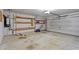 Spacious two car garage with built in shelving, concrete floor, and electric door opener at 4408 Jordan Oaks Way, Raleigh, NC 27604