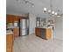 View of kitchen with a stainless steel refrigerator, tile floors and access to living room at 4408 Jordan Oaks Way, Raleigh, NC 27604